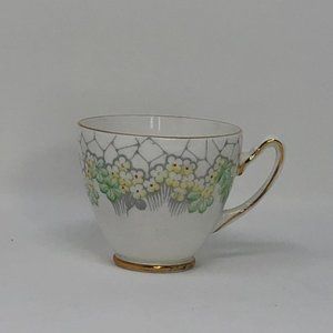 GLADSTONE BONE CHINA TEACUP #L 875 Decorated with - YELLOW FLOWERS with a light